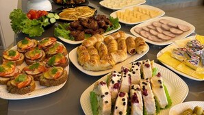A buffet table with various dishes including salads, meats, and pastries. - Hotel Panorama Samarkand (Samarkand)