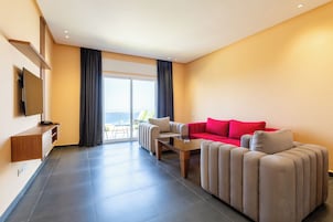 Deluxe Apartment, 2 Bedrooms, Sea View | Living area | 43-inch flat-screen TV with satellite channels, TV