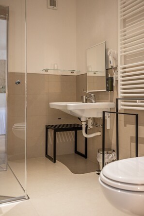 Shower, hair dryer, towels, toilet paper