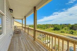 A wooden deck with a railing overlooking a road and greenery. - North Topsail Getaway w/ Panoramic Sound Views! (Sneads Ferry)