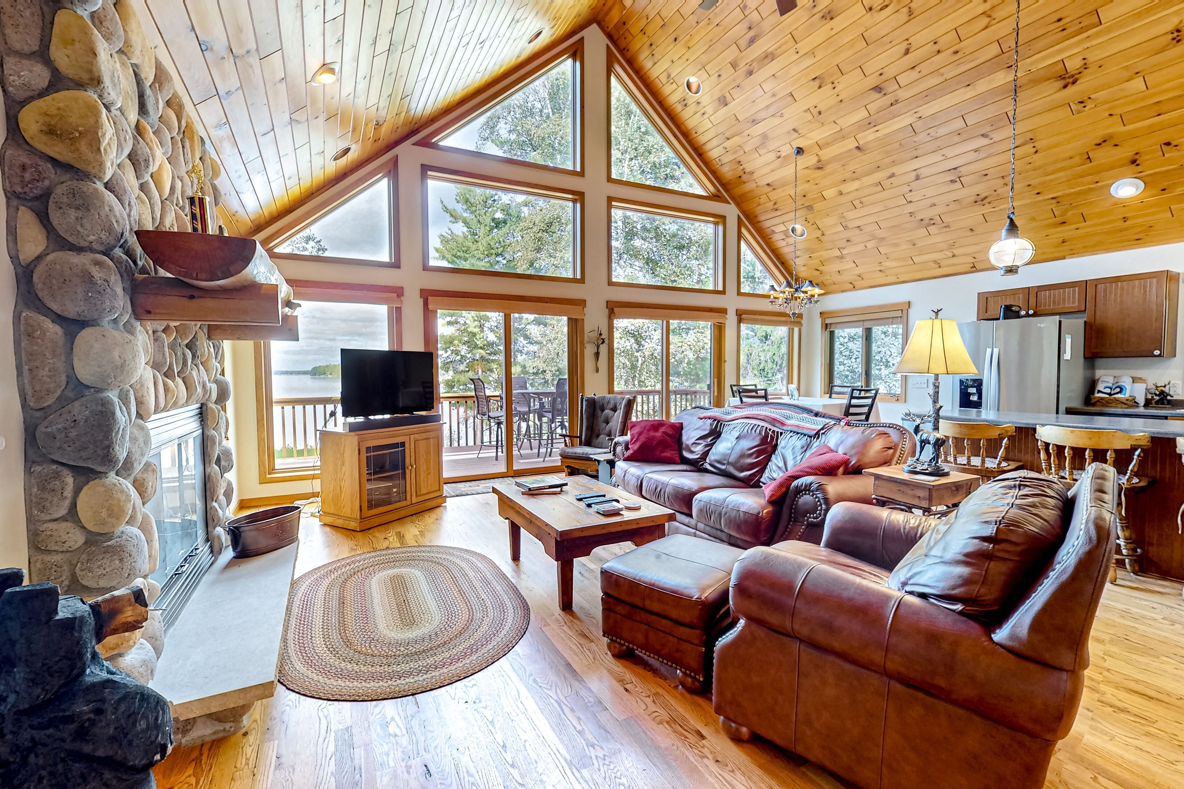 Waterfront beauty with private dock, fireplaces, foosball, grill, & firepit