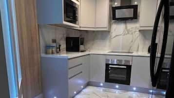 Fridge, oven, electric kettle, toaster
