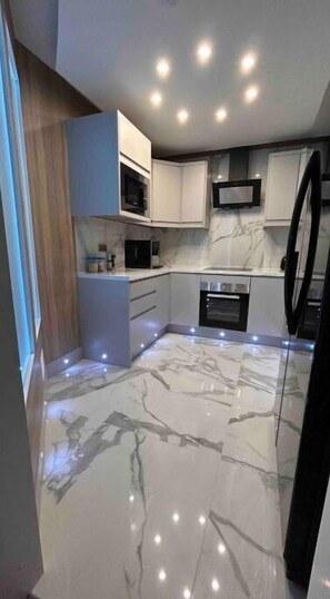 Fridge, oven, electric kettle, toaster