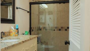 Shower, hair dryer, towels, soap