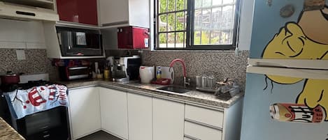 Microwave, stovetop, blender, cookware/dishes/utensils