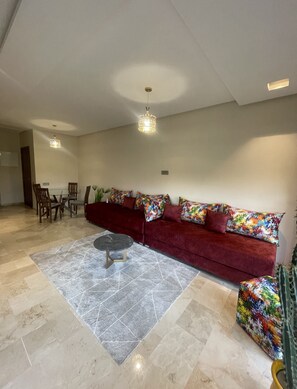 Exclusive Condo, 2 Bedrooms, Pool View, Garden Area | Living area | 55-inch Smart TV with cable channels