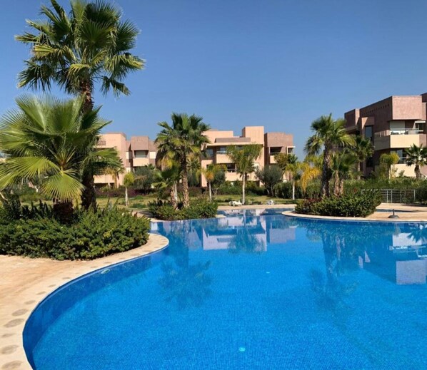 Exclusive Condo, 2 Bedrooms, Pool View, Garden Area | Living area | 55-inch Smart TV with cable channels