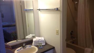 Shower, rainfall showerhead, towels, toilet paper