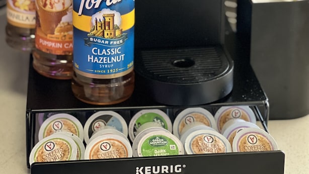 A coffee maker, Torani syrup, and coffee pods on a kitchen counter. - Spacious 3 Bedroom, Close Venice Beach (Marina del Rey)