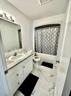 Hair dryer, towels, soap, shampoo