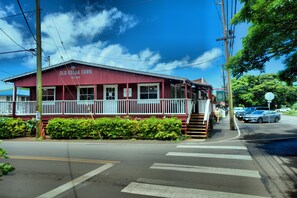 A red building with a white porch and a sign that reads 'Old Koloa Town.' - Sea and Sky Beachfront Condo, AC, Ocean Views, Sunrises, Steps to Beach! (Kapaʻa)