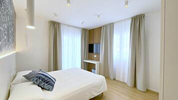 2 bedrooms, in-room safe, soundproofing, iron/ironing board