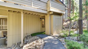 A house with a covered porch, a small entryway, and a stone pathway leading to the door. - Stylish Incline Village Vacation Rental w/ A/c! (Incline Village)