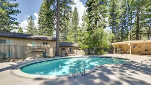 A swimming pool with a curved edge, surrounded by a concrete deck. - Stylish Incline Village Vacation Rental w/ A/c! (Incline Village)