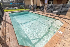 A heated pool - Spacious in Resort Themed Home: with Private Pool, Game Room & BBQ Near Disney!! (Kissimmee)