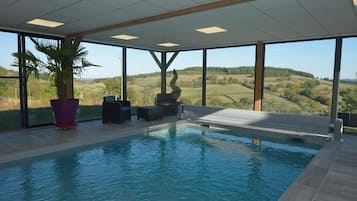 Indoor pool, pool umbrellas, sun loungers