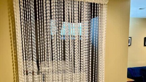 A room with a beige wall and a wooden floor. - Country Comfort near City Conveniences (Saint Paul)