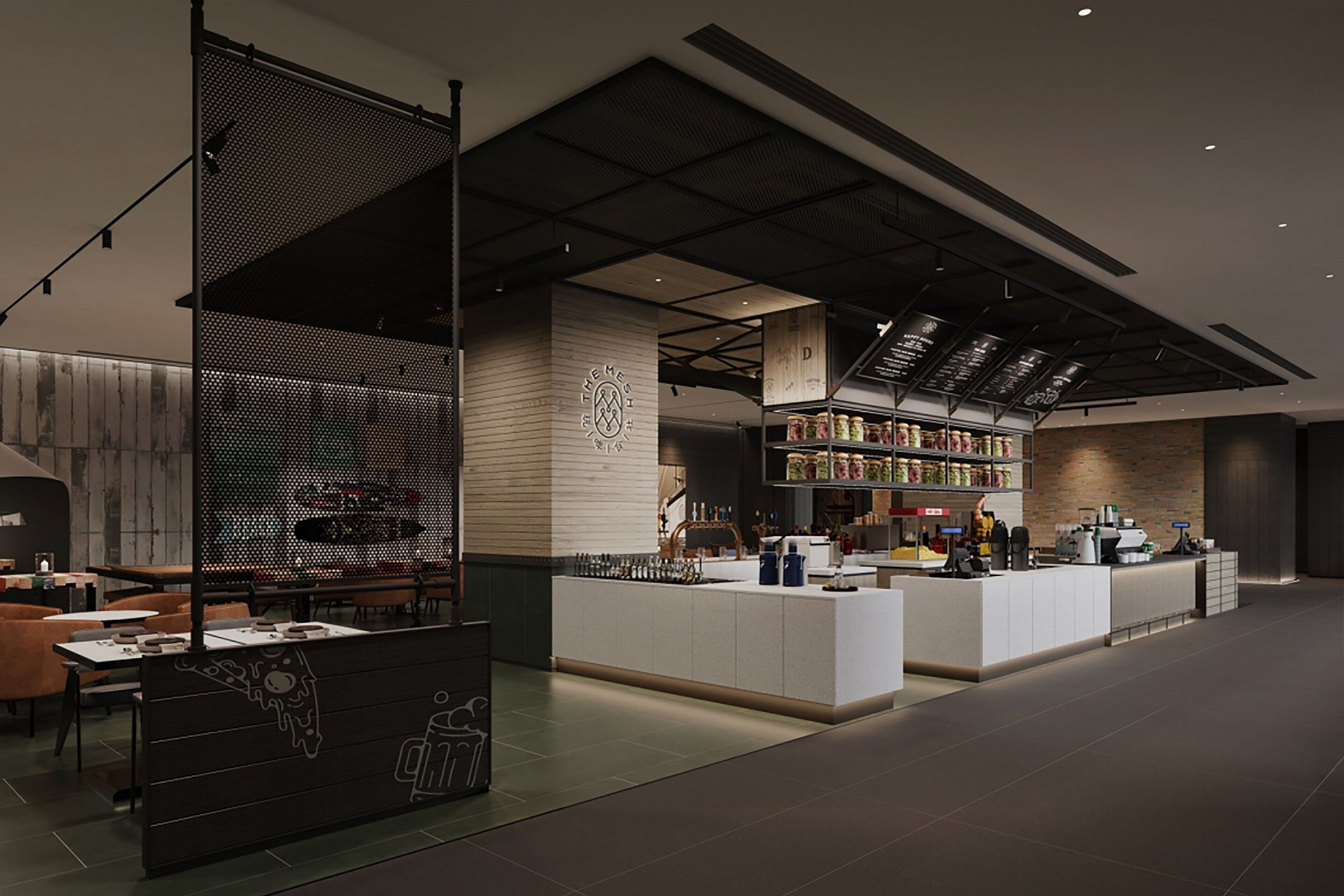 A modern cafe with a bar area, seating, and a display of food items.