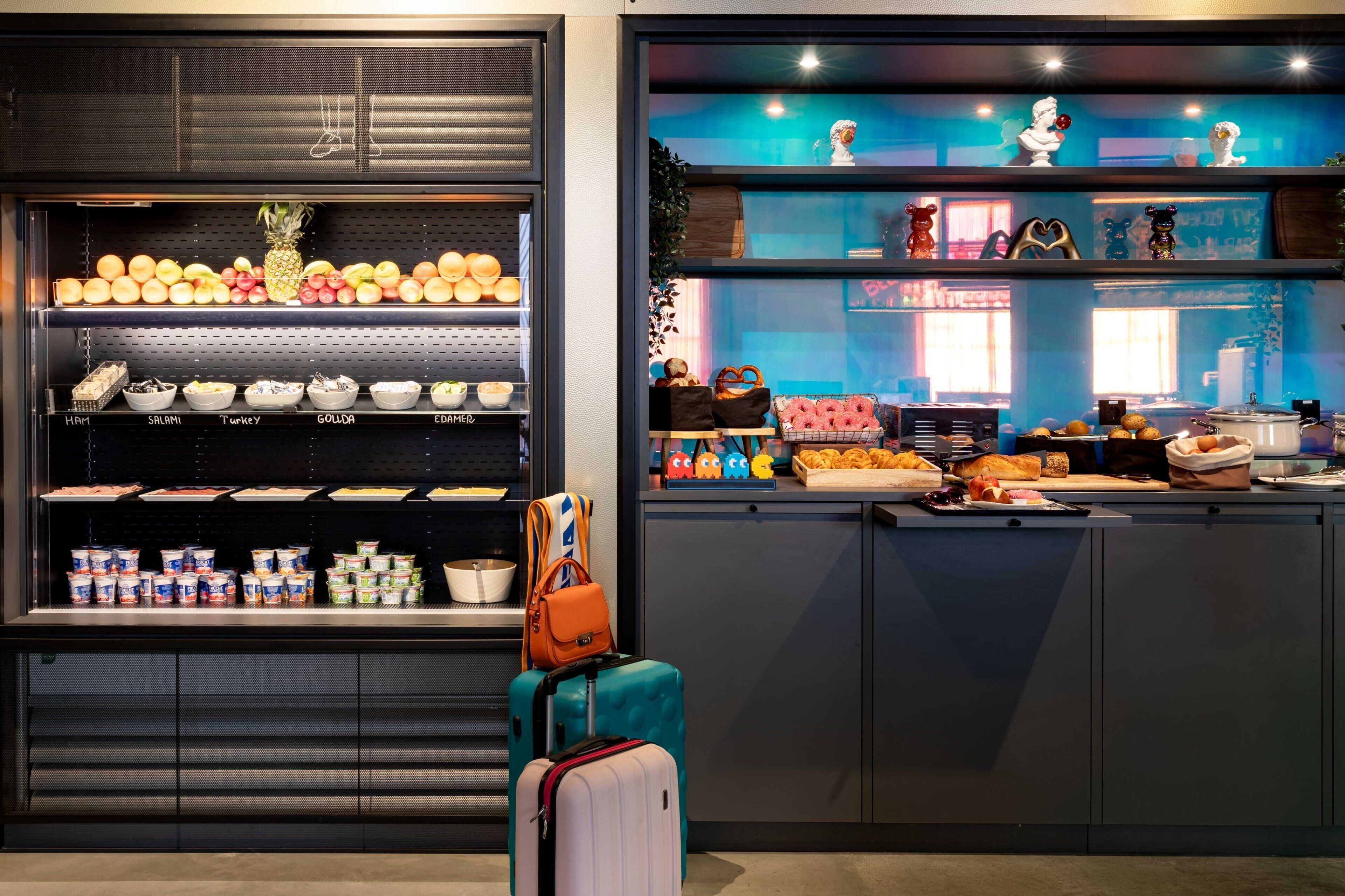 A kitchen area with a display of fruits and a variety of food items.