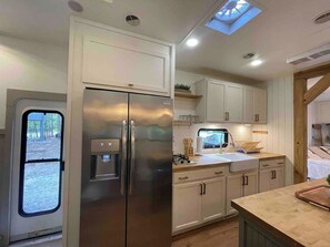 Fridge, coffee/tea maker, cookware/dishes/utensils - Discover Pine Haven Retreat—a modern farmhouse camper in Hochatown/Broken Bow (Broken Bow)