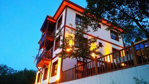 A multi-story building with balconies and a staircase leading to the entrance. - Manzara Konak Otel (Safranbolu)