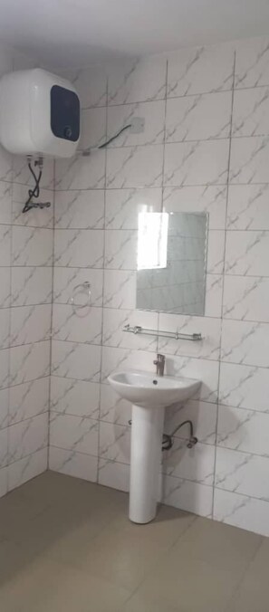 Executive Apartment | Bathroom | Slippers, towels, toilet paper - De-Convenant Apartment Short Term Rental (Abuja)