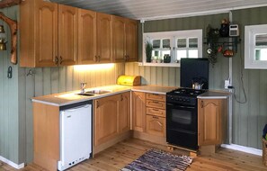 Fridge, stovetop, coffee/tea maker, cookware/dishes/utensils