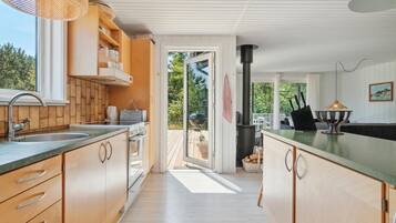 Fridge, stovetop, dishwasher, coffee/tea maker
