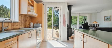 Fridge, stovetop, dishwasher, coffee/tea maker