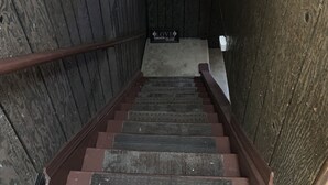 A wooden staircase with a sign reading "LOVE LAUGHTER HIGH - 1-800-555-1234". - Welcome to the Gathering Place! Where Families and friends can gather together.  (McKeesport)