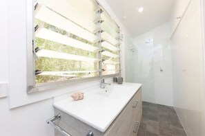 Shower, hair dryer, towels, soap