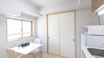 Deluxe Apartment | Living area | 32-inch flat-screen TV with digital channels
