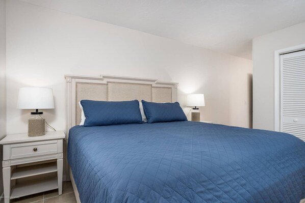 Master bedroom with a quality king mattress, closet and bathroom just outside the doorway - Peaceful Paradise Home | 1 Mile to Nokomis Beach | Dog Friendly | Quiet Neighborhood (Nokomis)