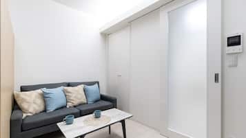 Classic Apartment | Living area | 32-inch flat-screen TV with digital channels