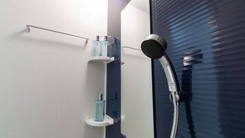 Separate bathtub and shower, free toiletries, hair dryer, slippers