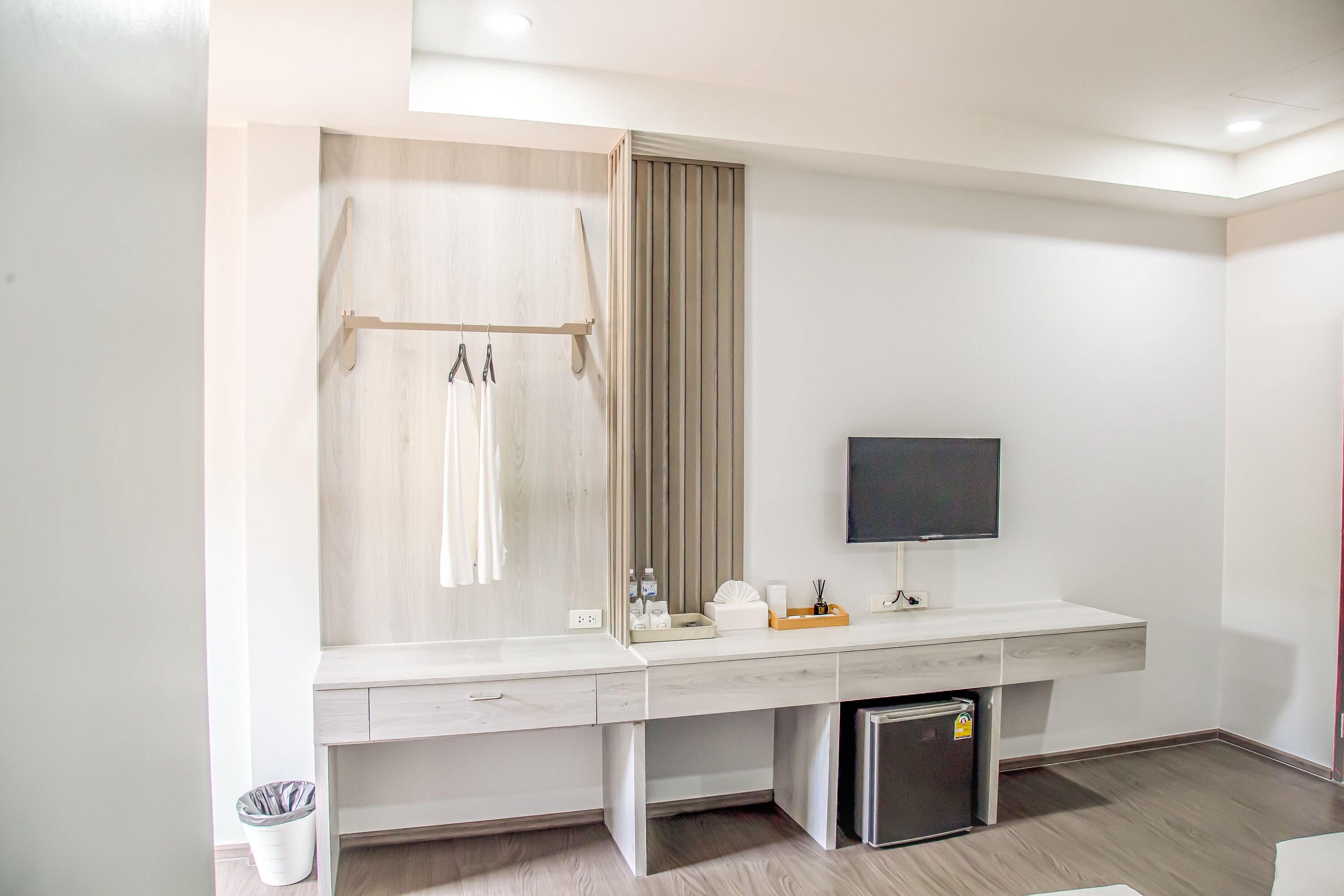 A modern bathroom with a shower, toilet, and sink.