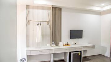 A modern bathroom with a shower, toilet, and sink.