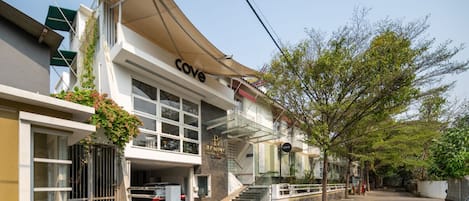 A two-story building with a cafe named 'Cove' on the ground floor.