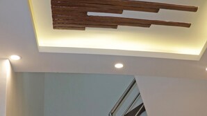 A staircase with granite steps, metal handrails, and a potted plant at the top. - Hotel Malati (Kathmandu)