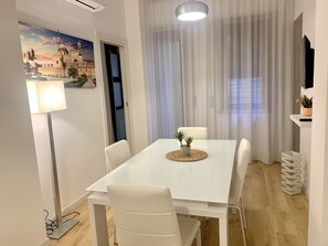Exclusive Apartment | Living area | 34-inch flat-screen TV with digital channels - Residence D'azeglio (Palermo)
