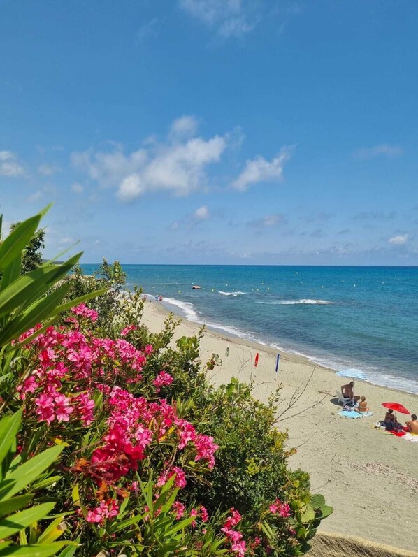 On the beach, sun-loungers, beach towels