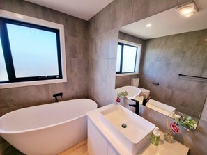 Bathtub, hair dryer, towels