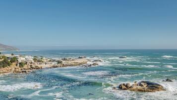 A coastal town with rocky shores and a clear view of the ocean.