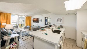 A compact apartment with a kitchenette, dining area, and a living space. - **THE OSPREY'S NEST** Condo & Pool + Last Key White Glove Service... (Key West)
