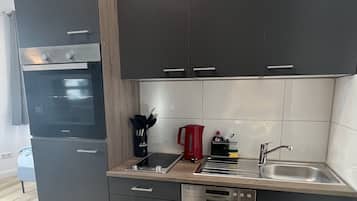 Mini-fridge, electric kettle, toaster, cookware/dishes/utensils