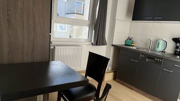City Apartment | Private kitchen | Mini-fridge, electric kettle, toaster, cookware/dishes/utensils
