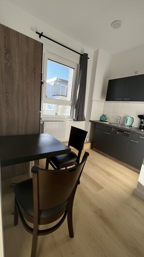 City Apartment | Private kitchen | Mini-fridge, electric kettle, toaster, cookware/dishes/utensils