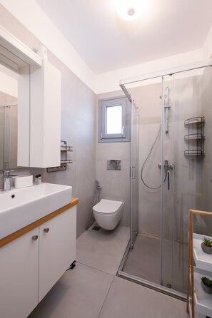Apartment, Pool Access | Bathroom | Shower, hair dryer, towels, soap