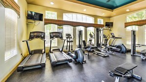 A gym with treadmills, elliptical machines, and weight equipment. - Walk to Papago Park: Central Phoenix Condo (Phoenix)