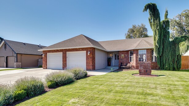 A two-story house with a garage, a brick exterior, and a well-maintained lawn. - 6 Mi to Dtwn Yakima: Central Washington Home (Yakima)